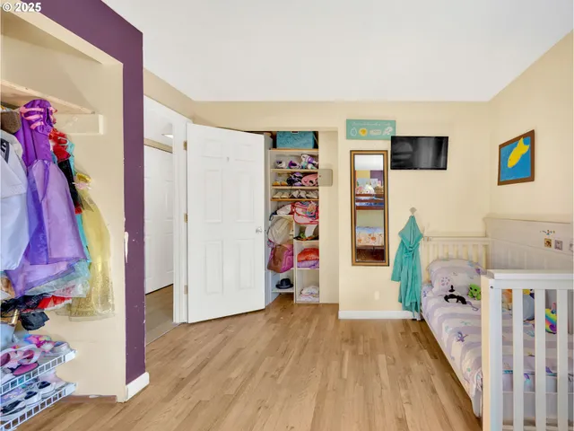 a view of a room with toys and wooden floor