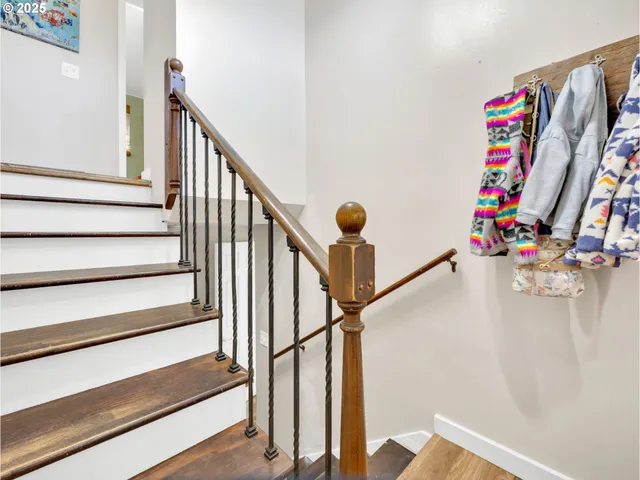 a view of entryway with wooden floor and stairs
