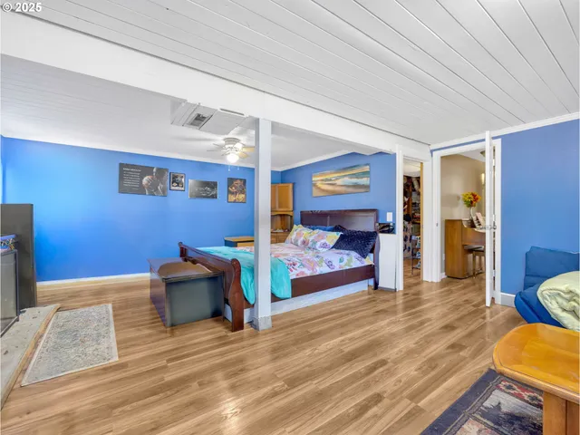 a view of a livingroom with furniture and a flat screen tv