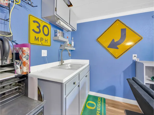 a kitchen with a sink and cabinets
