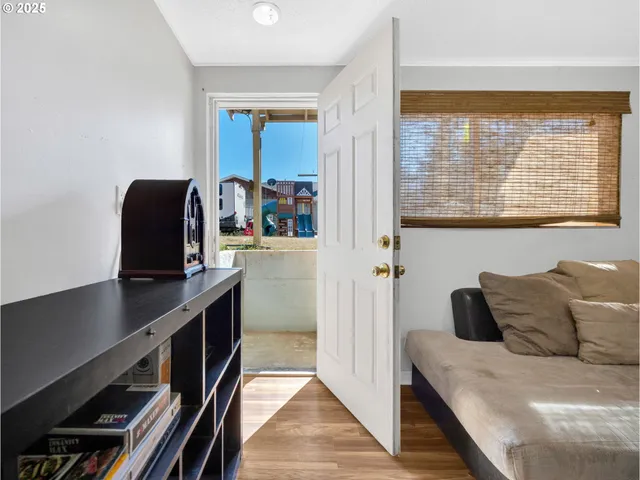 a bedroom with a bed and a desk