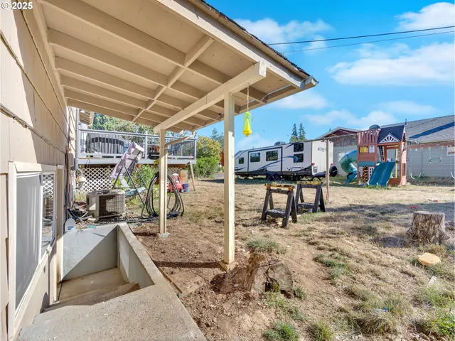 a view of a patio with a table and chairs