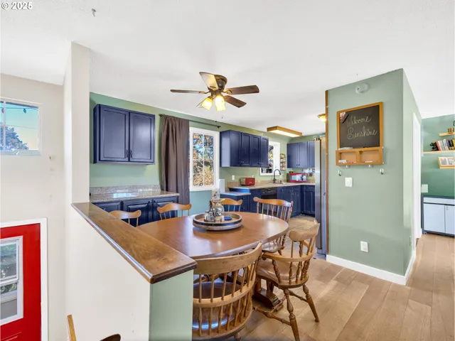 a kitchen with a dining table and chairs