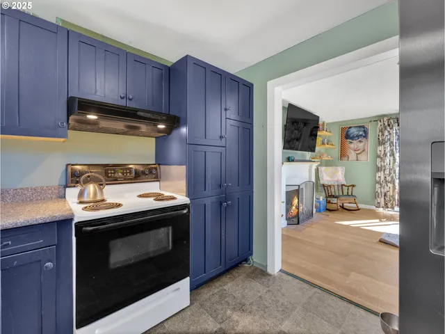 a kitchen with a stove and a refrigerator