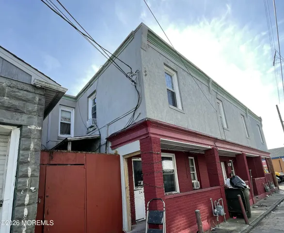 a front view of a house with parking