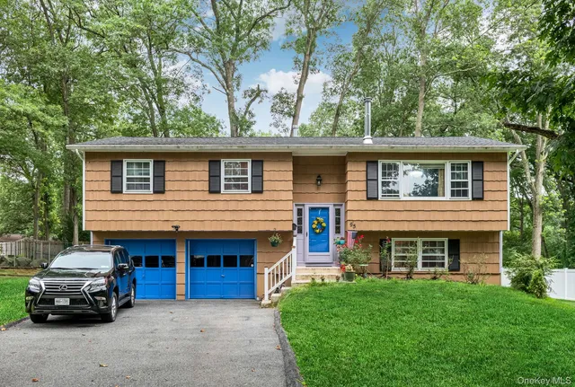 a car parked in front of white house