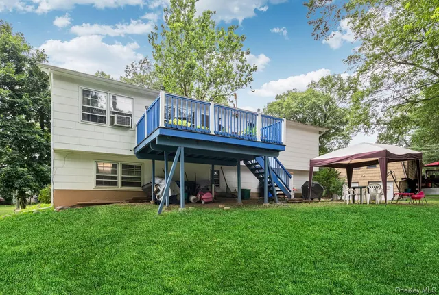 a view of a chairs and table in the yard