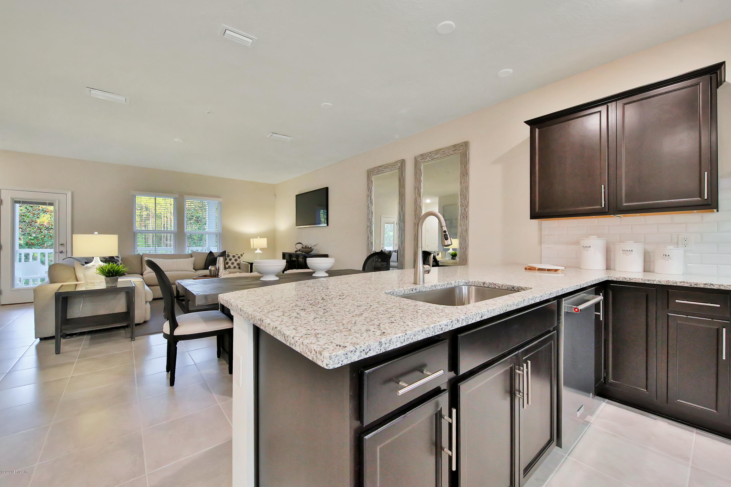 152 Spring Tide Way Ponte Vedra, FL 32081 - Photo 4 of 7 a kitchen with a sink and cabinets