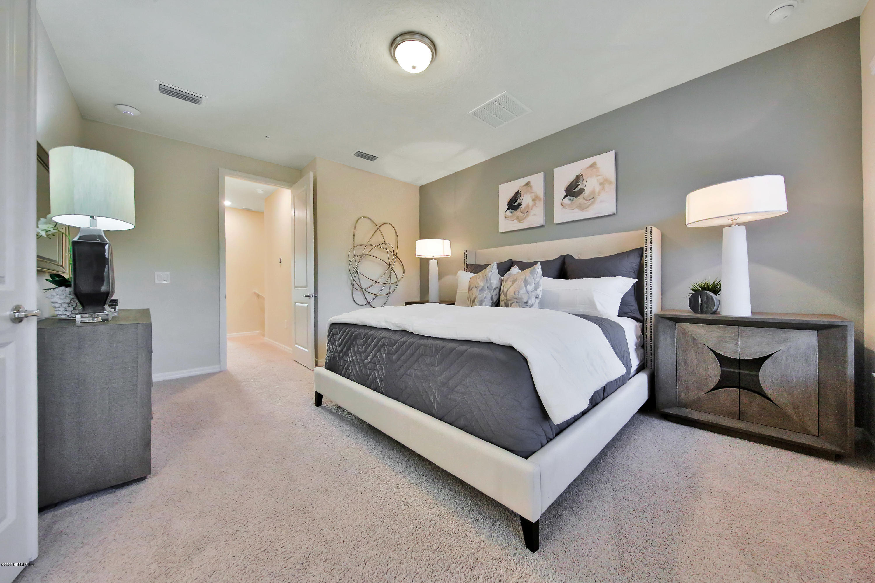 152 Spring Tide Way Ponte Vedra, FL 32081 - Photo 5 of 7 a bedroom with bed and a lamp