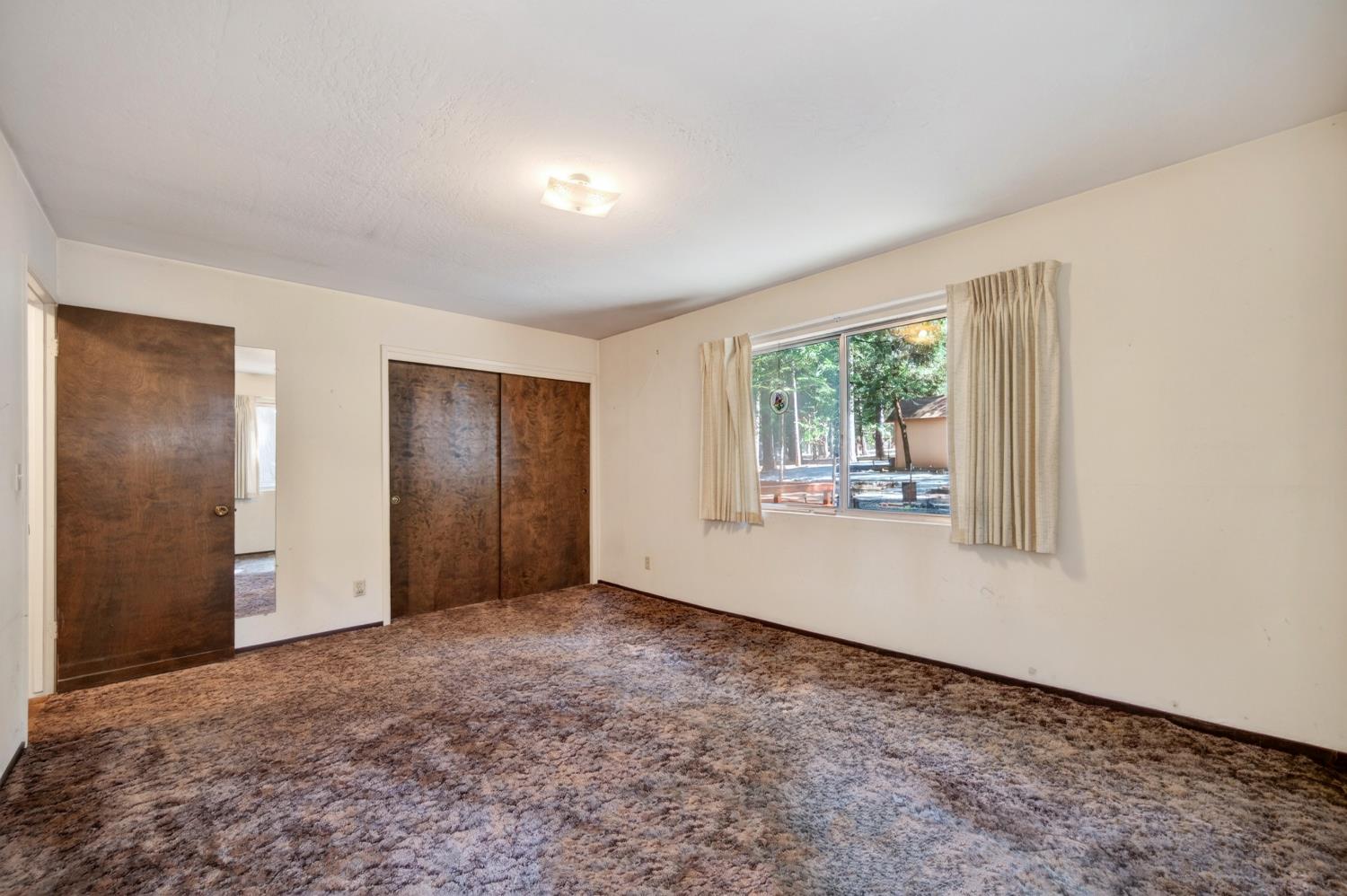 20191 Kit Court Volcano, CA 95689 - Photo 32 of 54 an empty room with windows