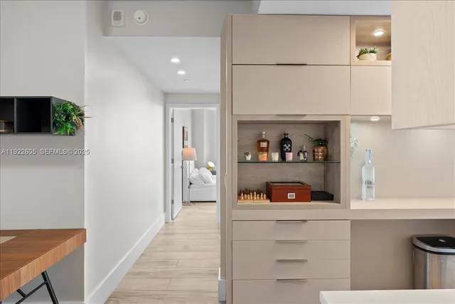 a bedroom with a bed and a painting on the wall