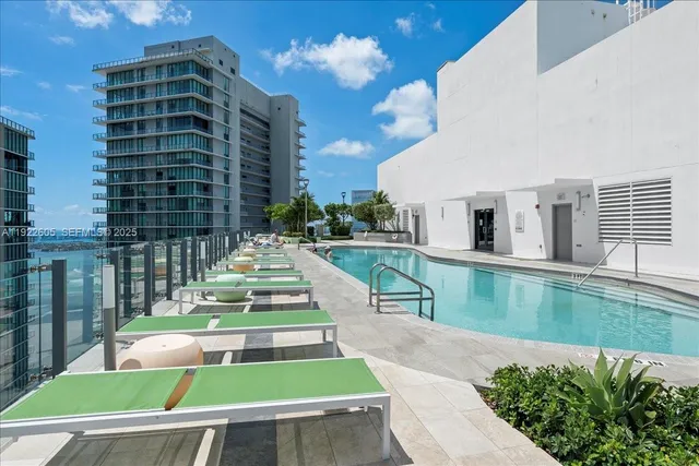 a bathroom with a blue sink and a mirror