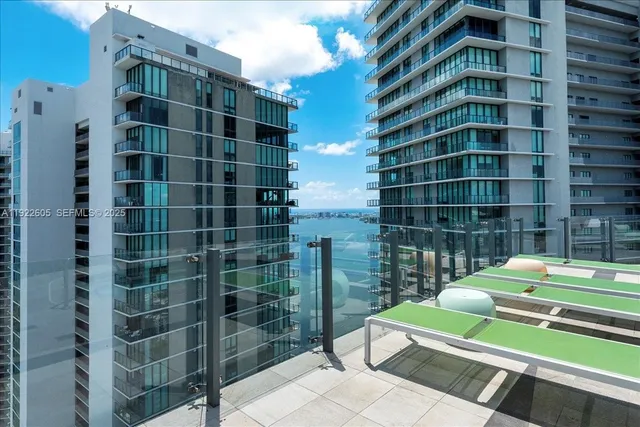 an aerial view of residential house with outdoor space and swimming pool