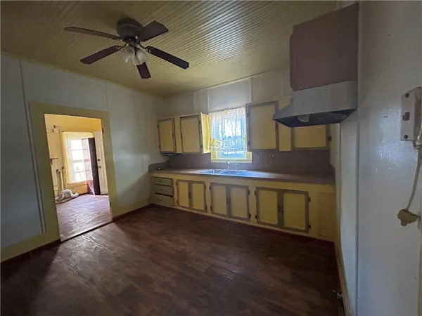 a view of room with window and wooden floor