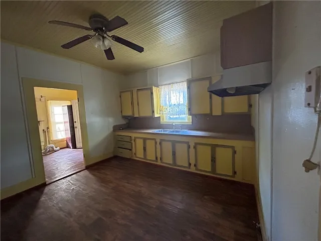 a view of room with window and wooden floor