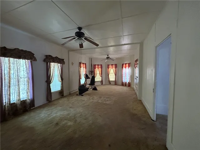 a view of a room with closet and windows