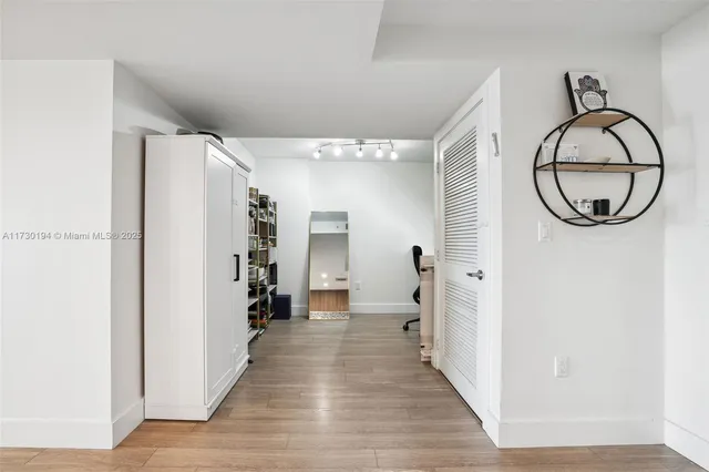 a living room with furniture and a lamp