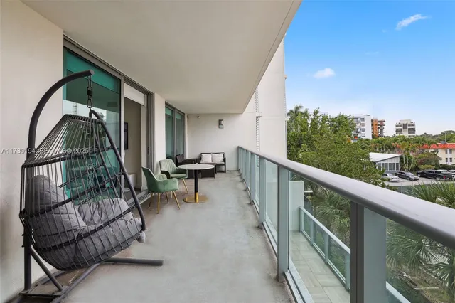 a view of two chairs in balcony