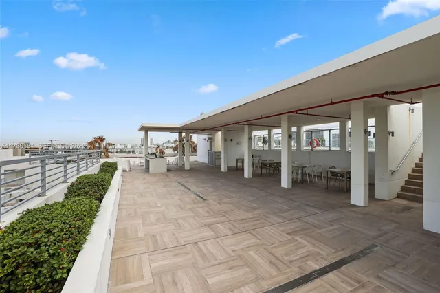 an aerial view of a house with outdoor space