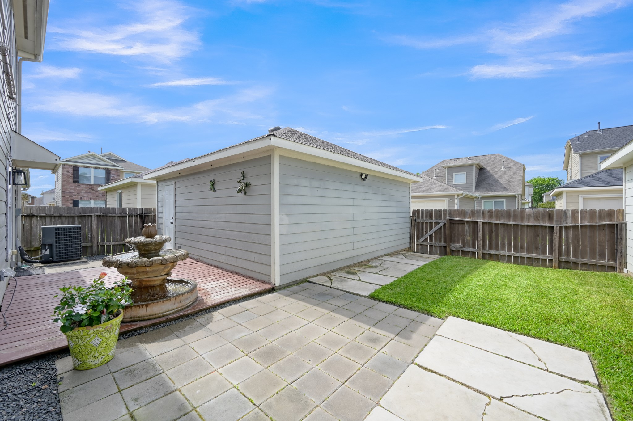 21815 Mossy Field Lane Spring, TX 77388 - Photo 34 of 39 Backyard features deck and paver patio perfect for entertaining.
