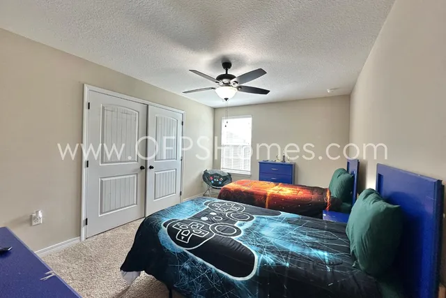 a bedroom with bed and window