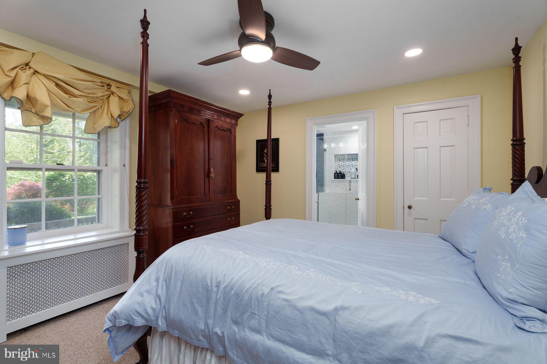821 Pretty Brook Road Princeton, NJ 08540 - Photo 20 of 32 a bedroom with a bed ceiling fan and a window