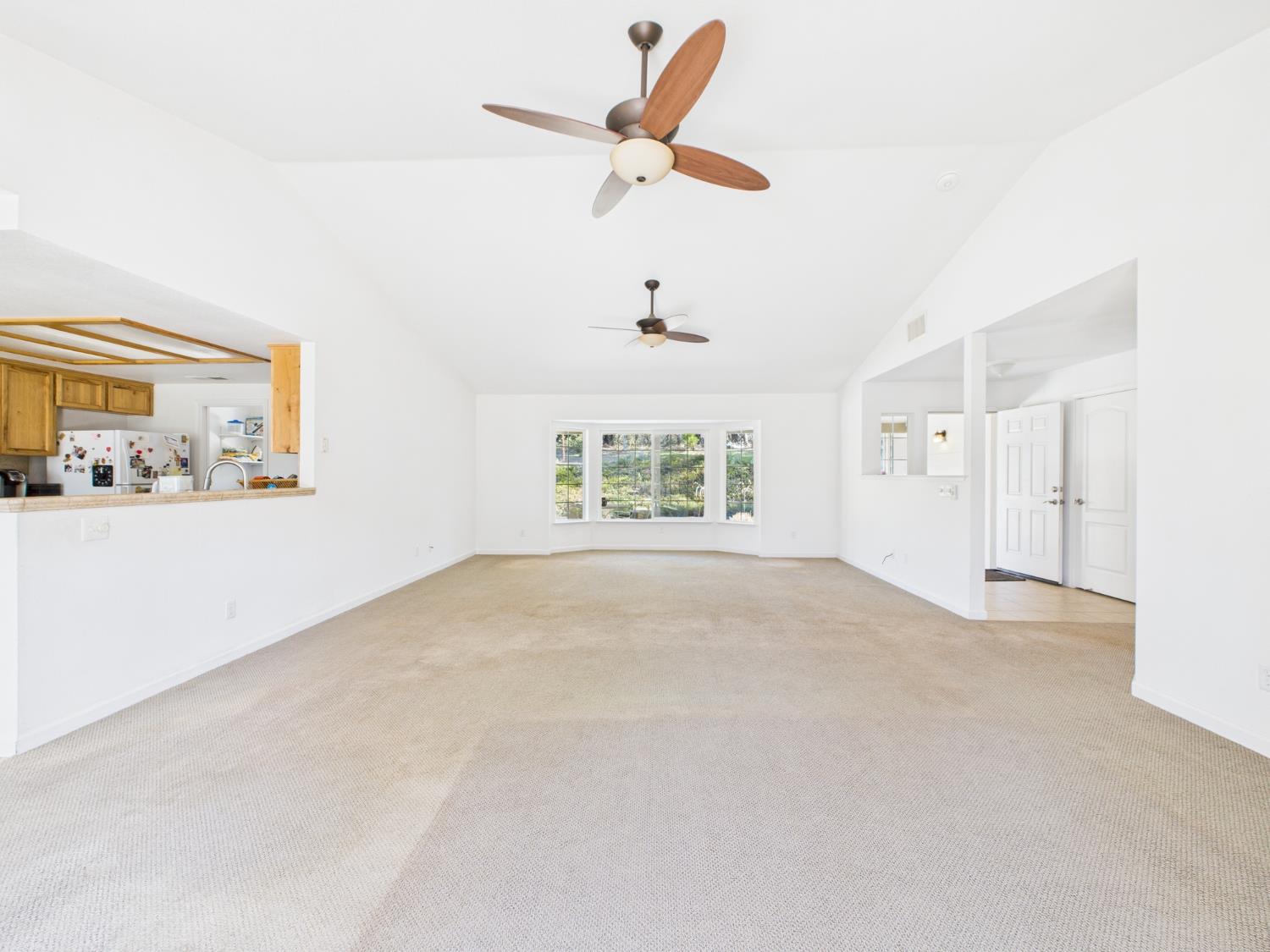 37550 Mountain Lakes Road Oakhurst, CA 93644 - Photo 9 of 63 a view of an empty room with a window
