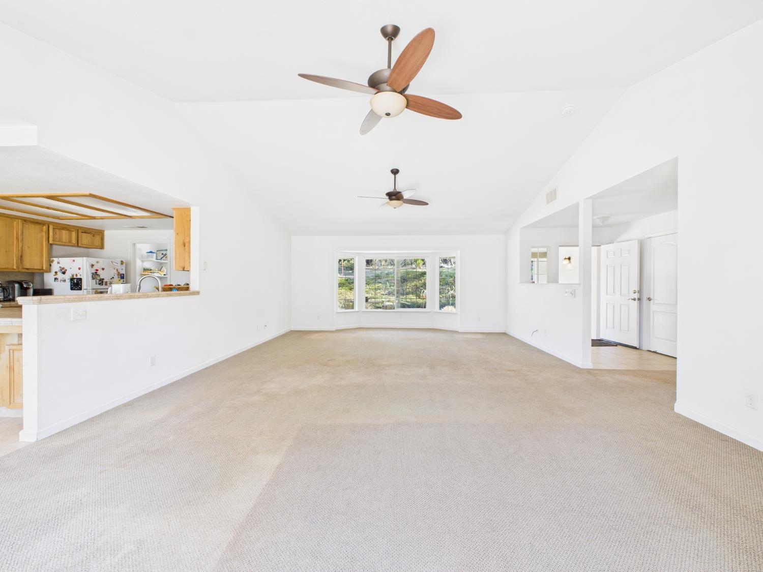 37550 Mountain Lakes Road Oakhurst, CA 93644 - Photo 10 of 63 a view of an empty room with a window