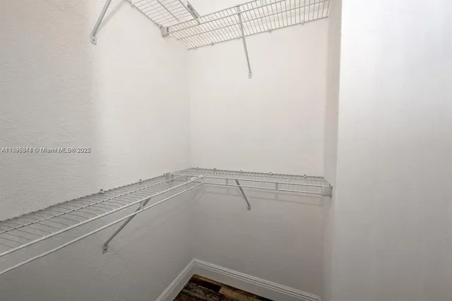 a view of a room with racks on the wall