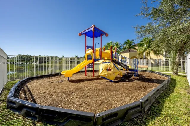 a swimming pool with yard and outdoor seating