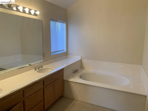 a bathroom with a bathtub and a sink