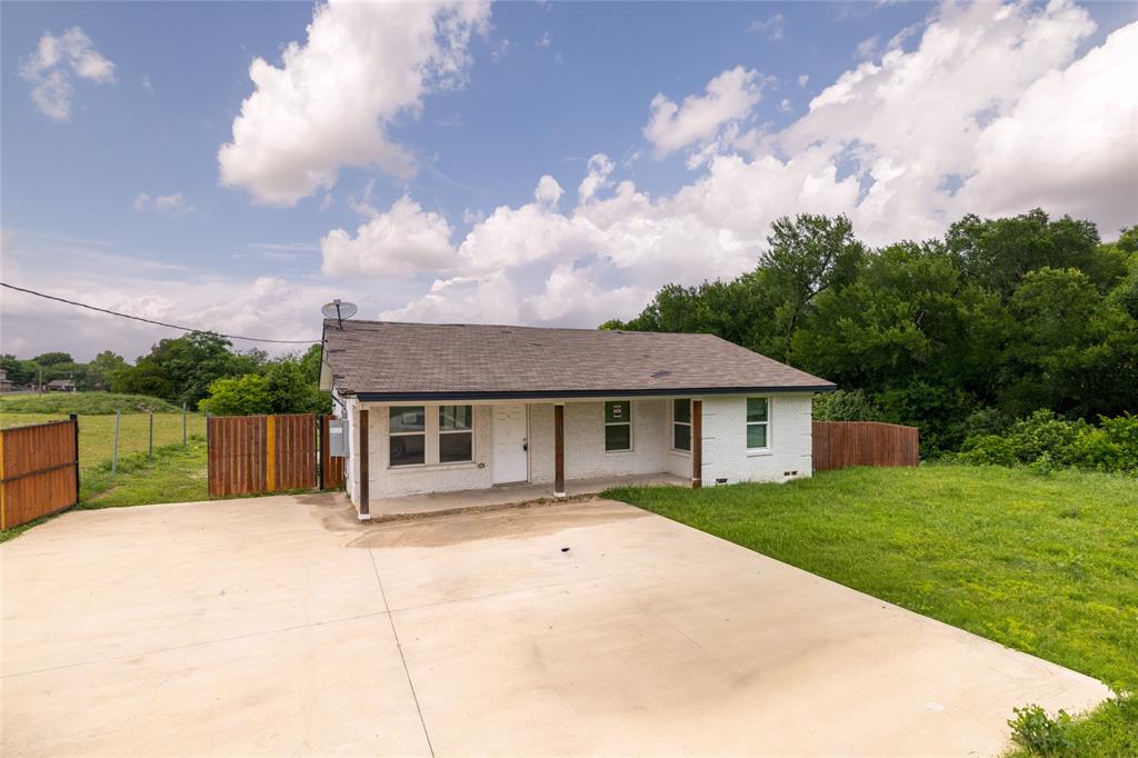 805 East Belt Line Road DeSoto, TX 75115 - Photo 1 of 15 a view of a house with a backyard