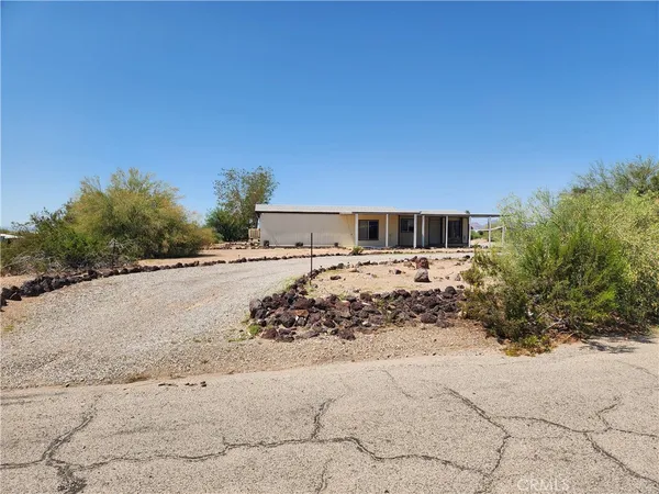 a view of a backyard of the house