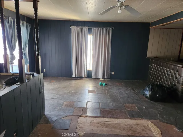 a view of an empty room with glass door