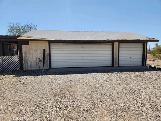 a front view of a house with garage