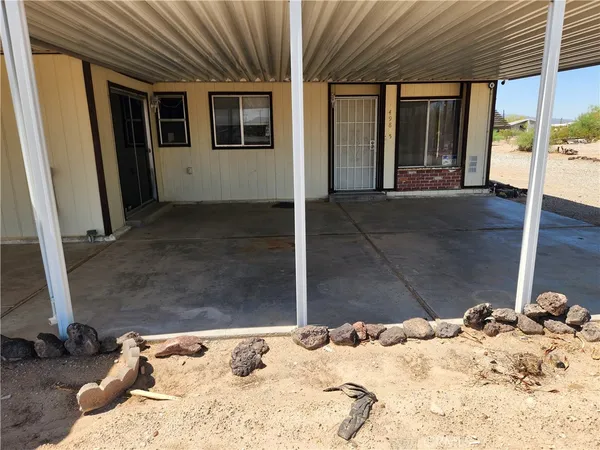 a view of a sink and yard from a patio