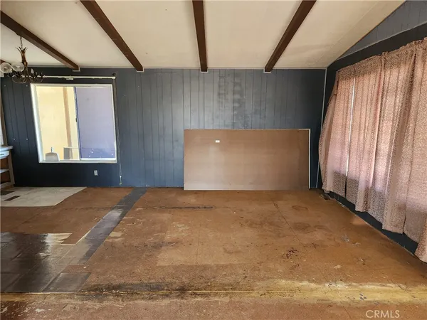 a view of room with furniture and window