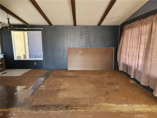 a view of room with furniture and window