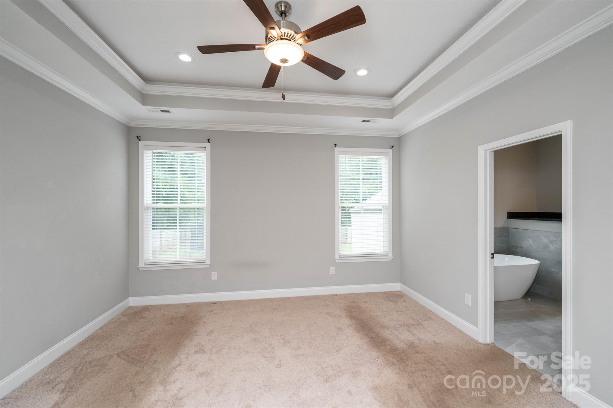 100 Holly Drive Duncan, SC 29334 - Photo 14 of 41 a view of an empty room with a window and a ceiling fan