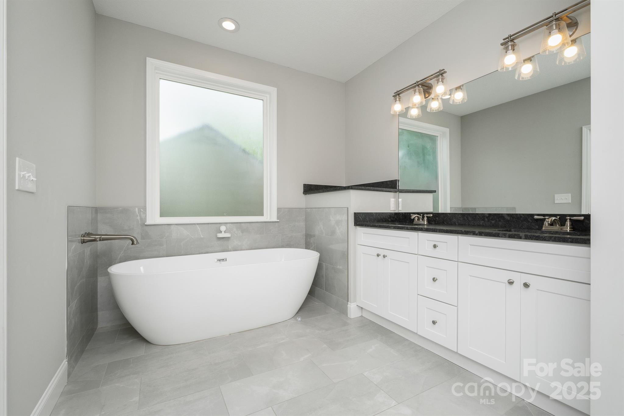 100 Holly Drive Duncan, SC 29334 - Photo 18 of 41 a spacious bathroom with a double vanity sink mirror and bathtub