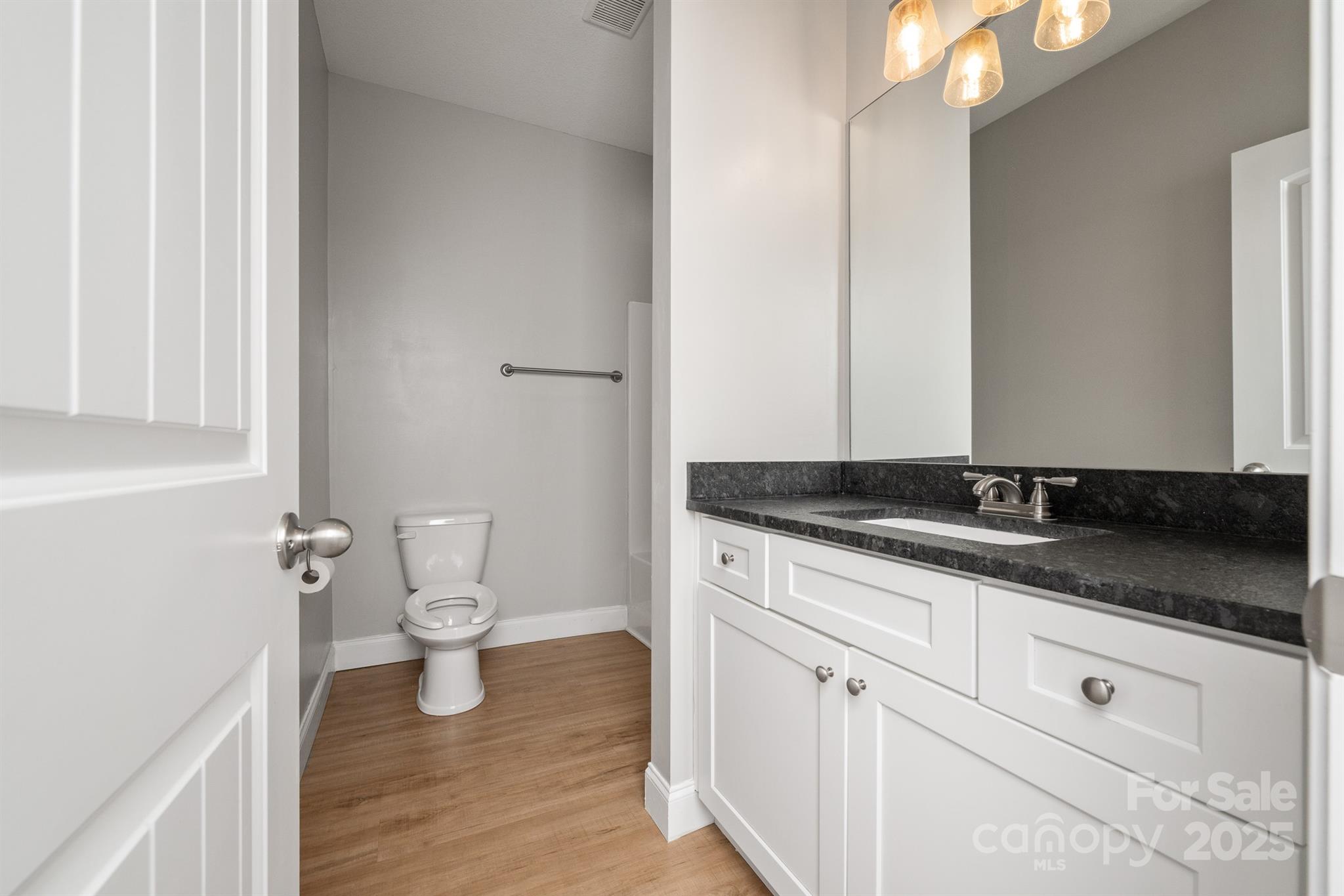100 Holly Drive Duncan, SC 29334 - Photo 21 of 41 a bathroom with a granite countertop sink and a toilet