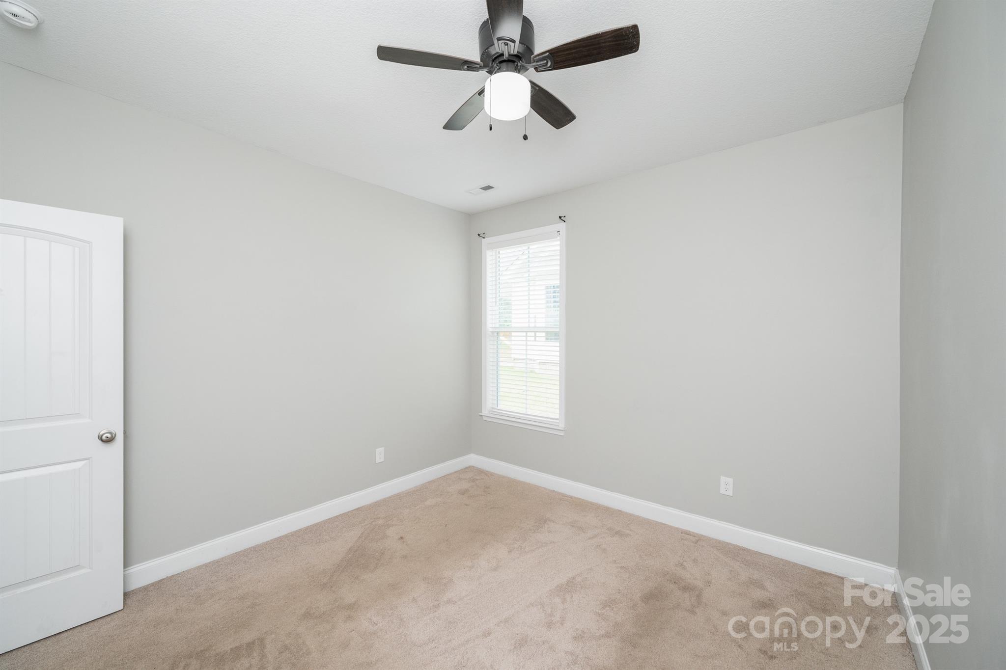 100 Holly Drive Duncan, SC 29334 - Photo 29 of 41 an empty room with a window and a fan
