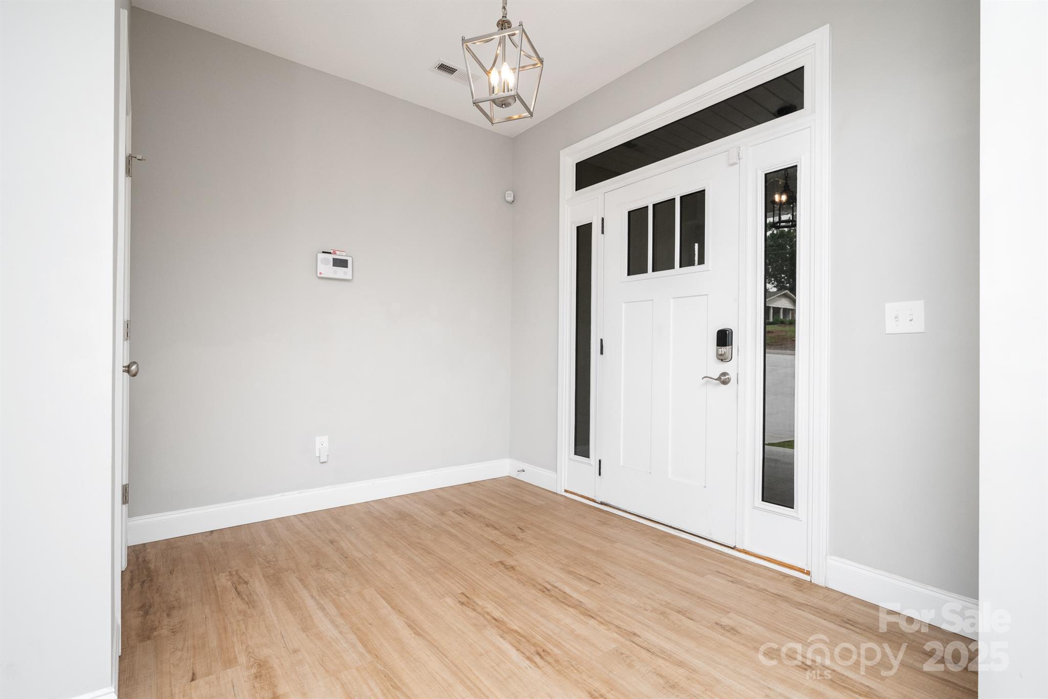 100 Holly Drive Duncan, SC 29334 - Photo 7 of 41 a view of a hallway with wooden floor and staircase
