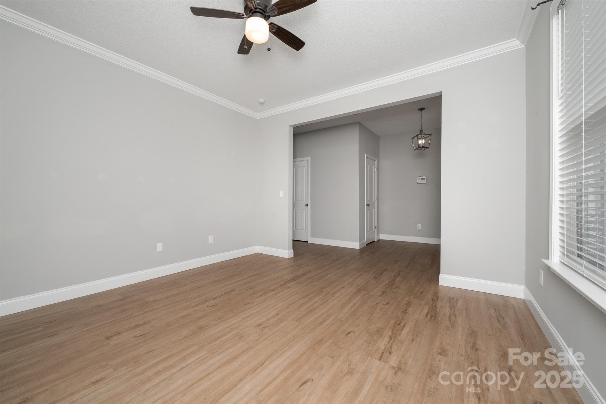 100 Holly Drive Duncan, SC 29334 - Photo 9 of 41 a view of an empty room with wooden floor and window