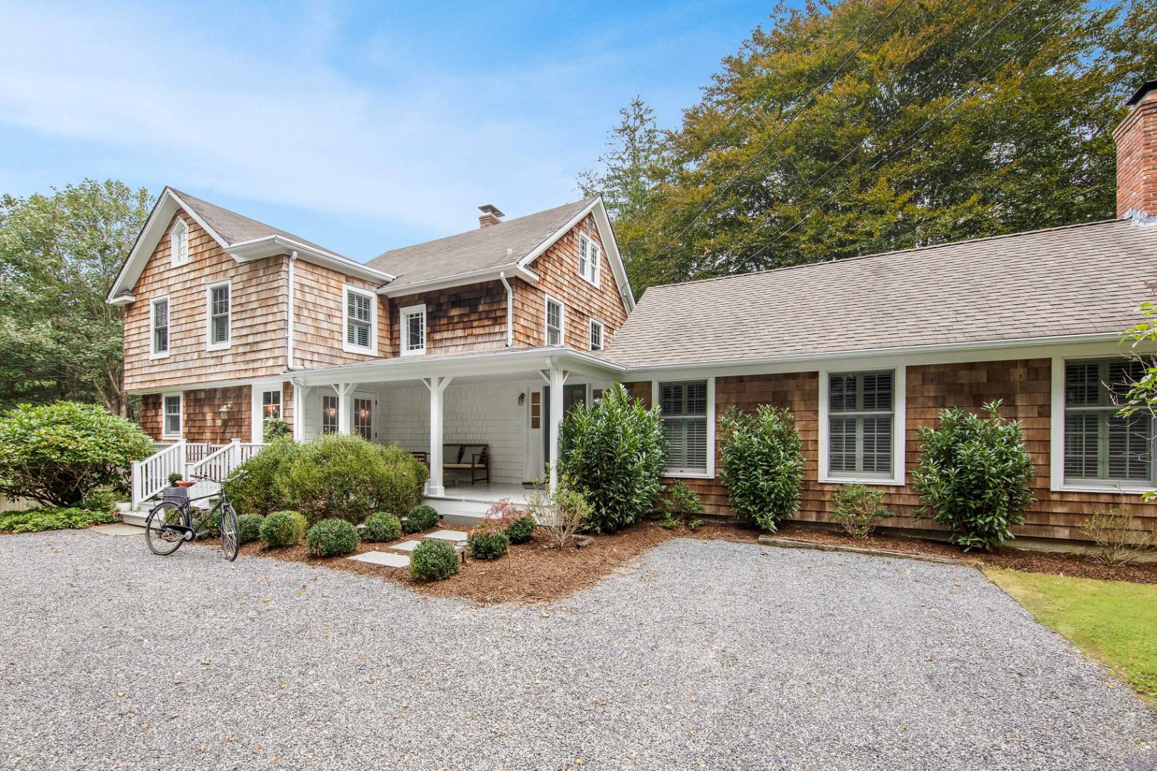 46 Maple Lane East Hampton, NY 11937 - Photo 1 of 21 front view of a house with a yard