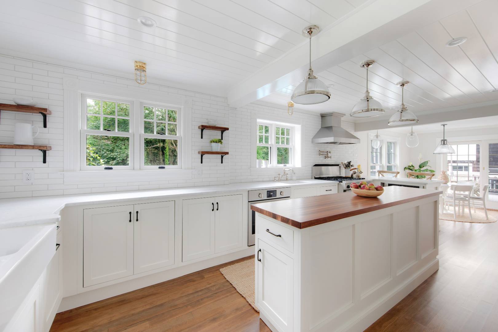 46 Maple Lane East Hampton, NY 11937 - Photo 2 of 21 a kitchen with kitchen island a sink stove and cabinets