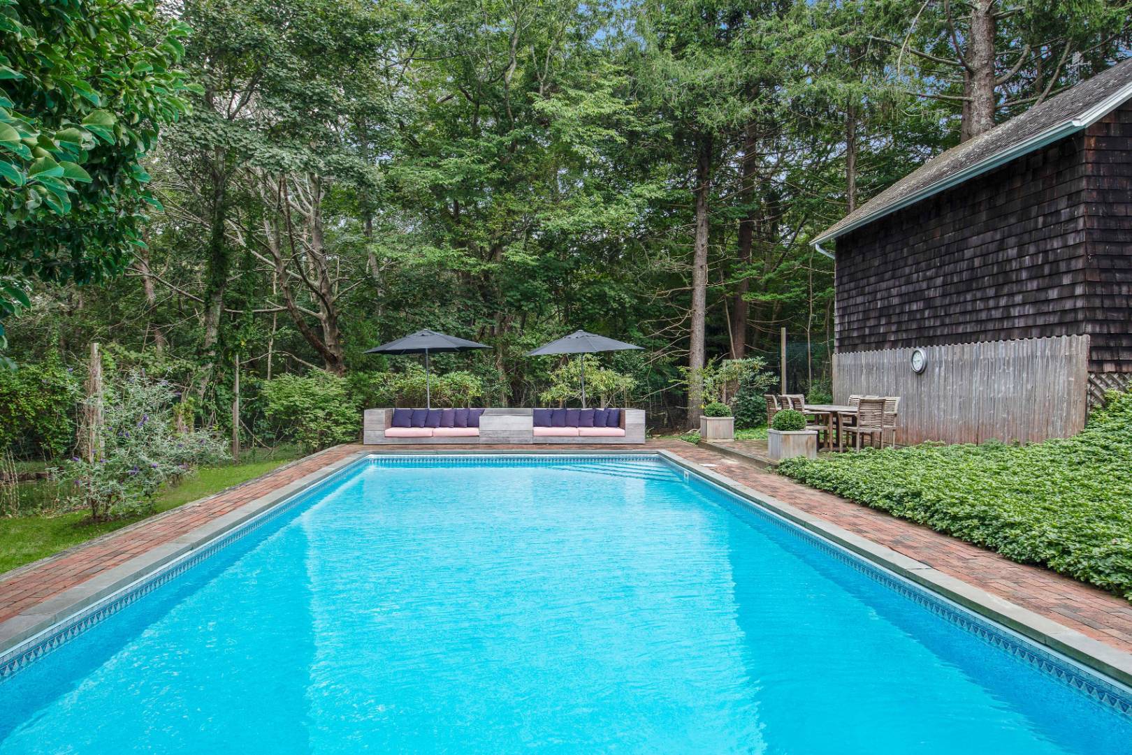 46 Maple Lane East Hampton, NY 11937 - Photo 18 of 21 a view of a swimming pool with a patio and a yard