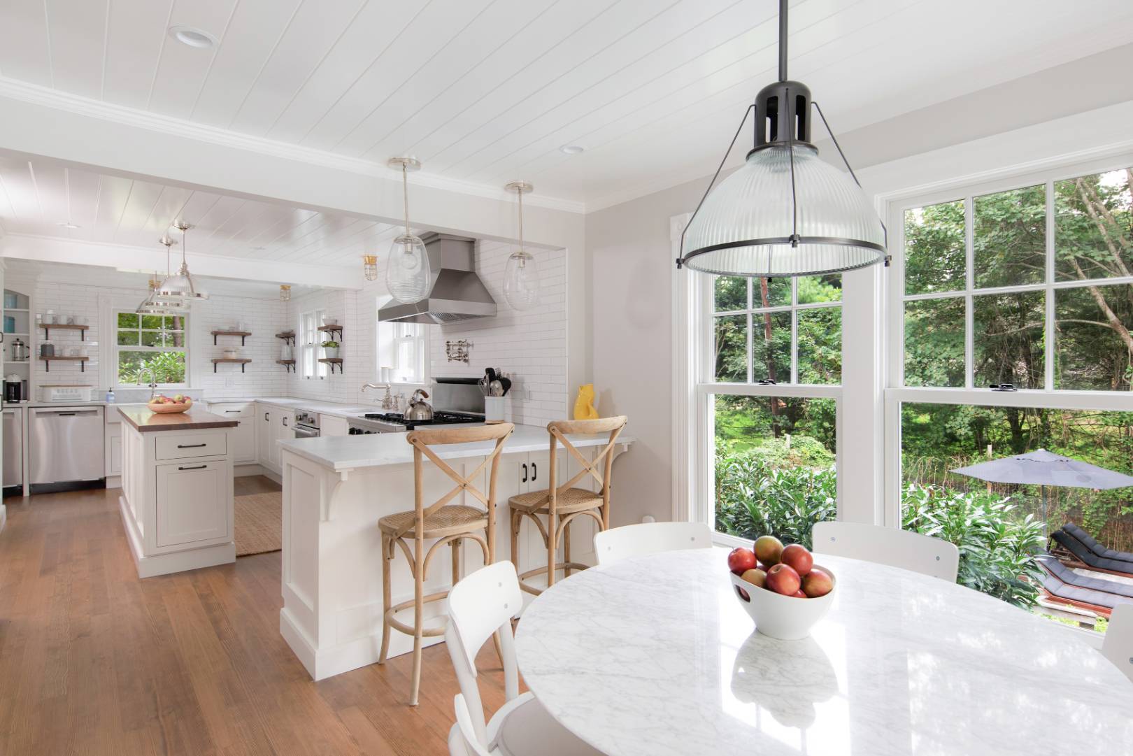 46 Maple Lane East Hampton, NY 11937 - Photo 3 of 21 a kitchen with stainless steel appliances a dining table chairs and couches with wooden floor