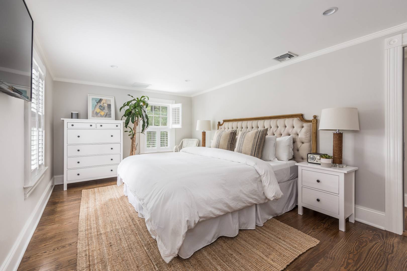 46 Maple Lane East Hampton, NY 11937 - Photo 9 of 21 a bedroom with a bed and a dresser