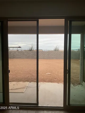 a view of an empty room with windows